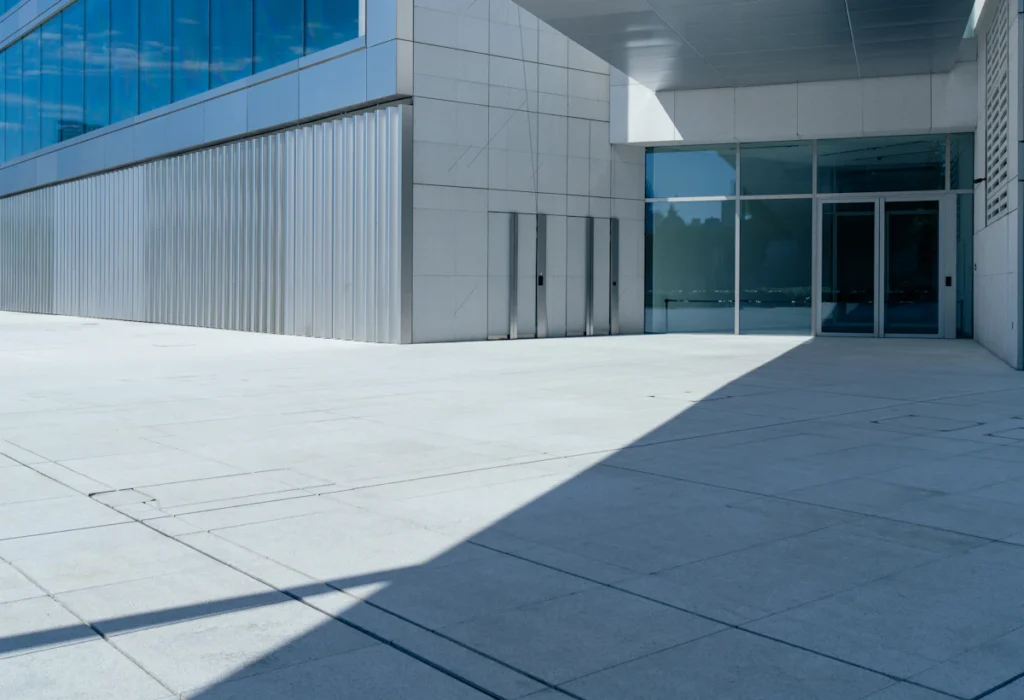 Contemporary building entrance with a paved plaza