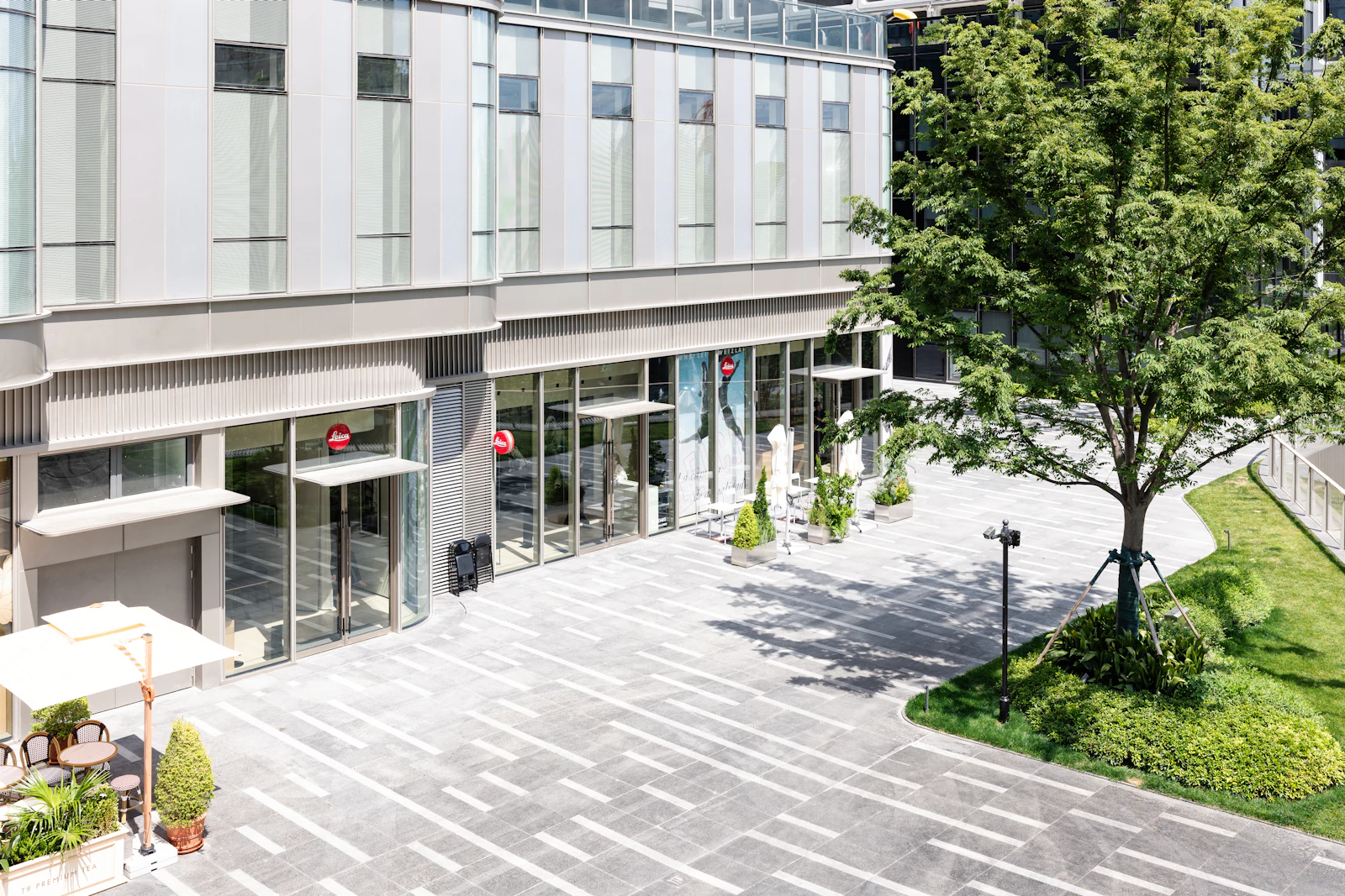 Commercial paver plaza at a modern building entrance