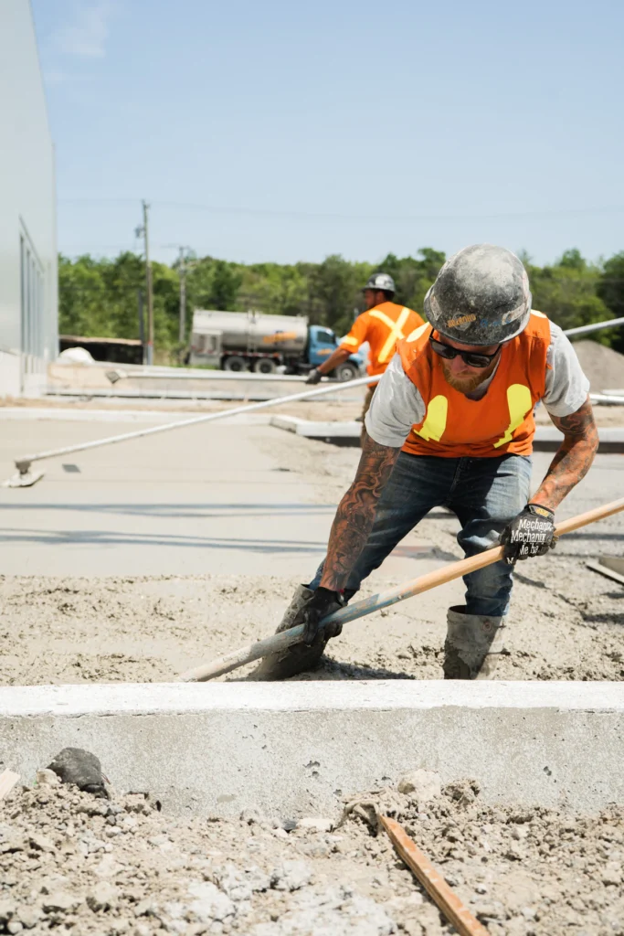 Crew placing concrete for a walkway