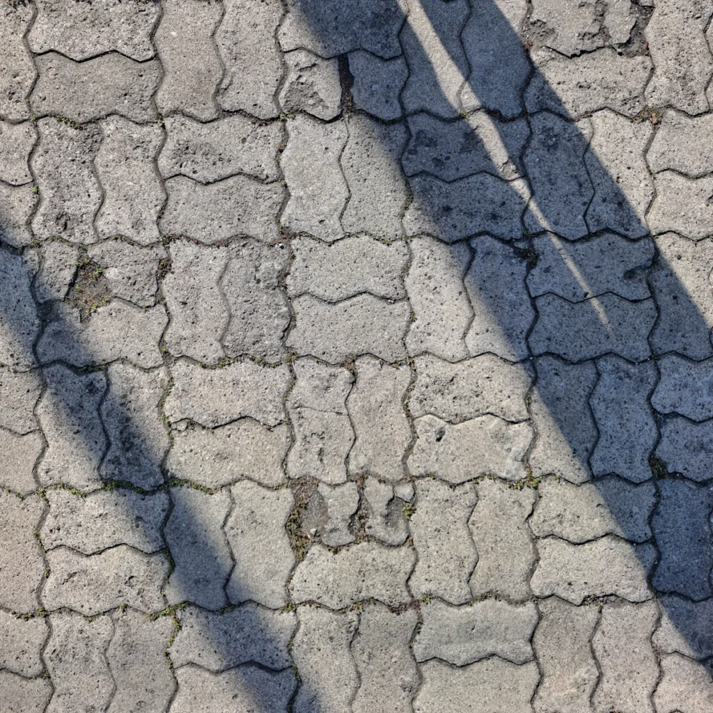Interlocking concrete pavers with crisp joints